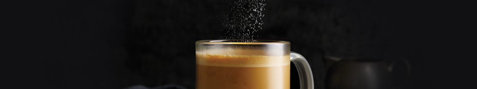 sweetener sprinkled into coffee